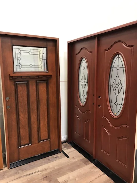 Wood grain entry doors with oval decorative glass