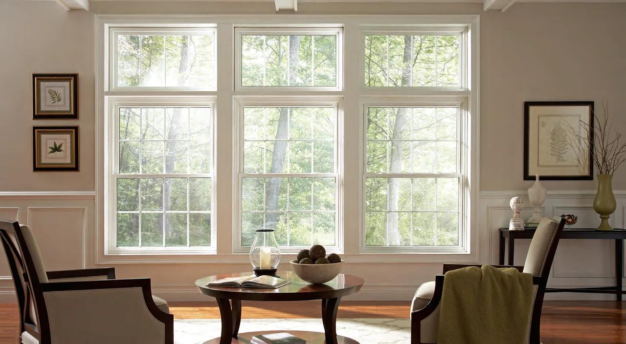 Bright living room with tall white Mezzo double hung windows