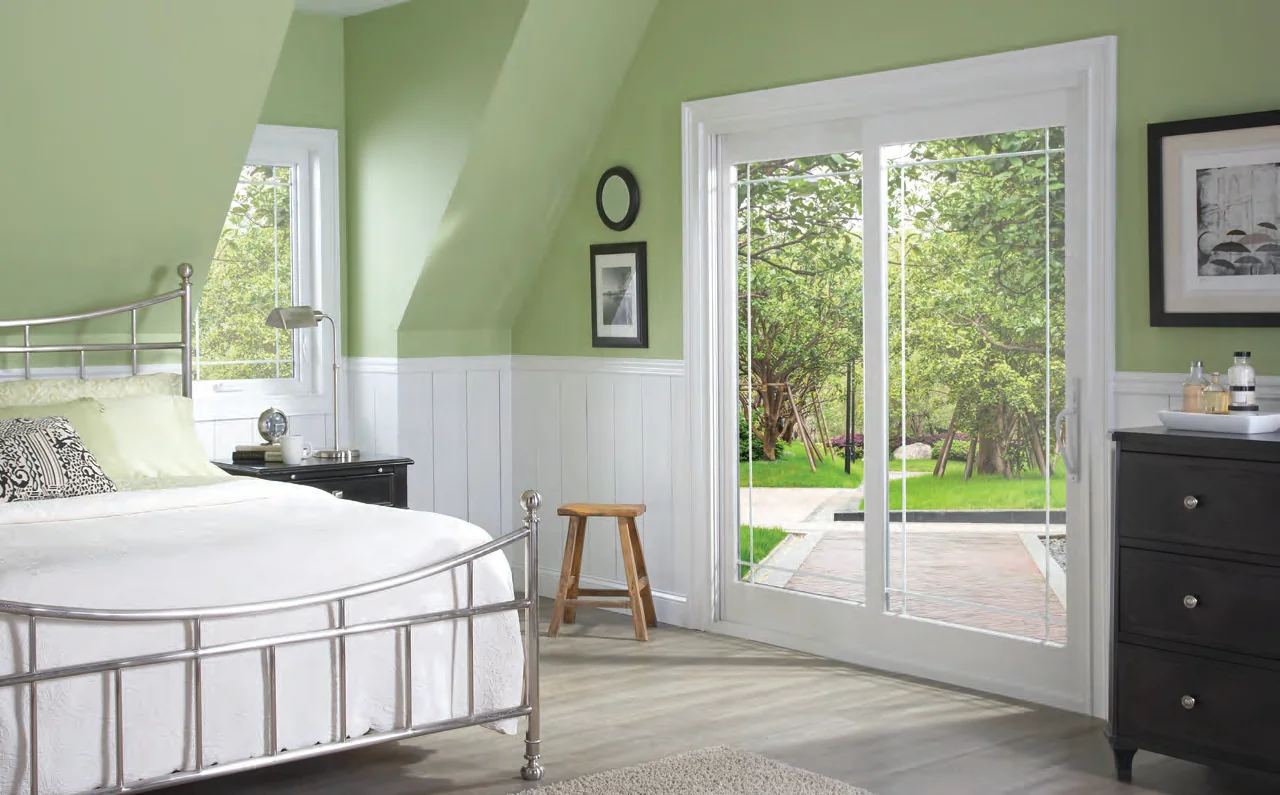French style sliding patio door with wide rails in a sunny bedroom